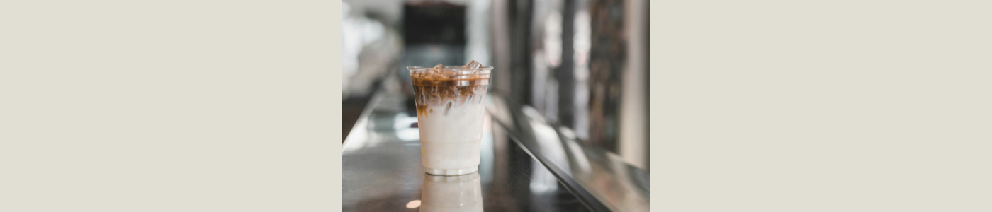 to go cup of iced coffee on a counter