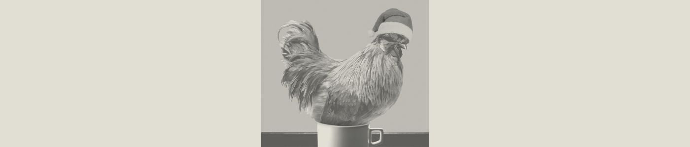 a chicken laying on a cup of eggnog