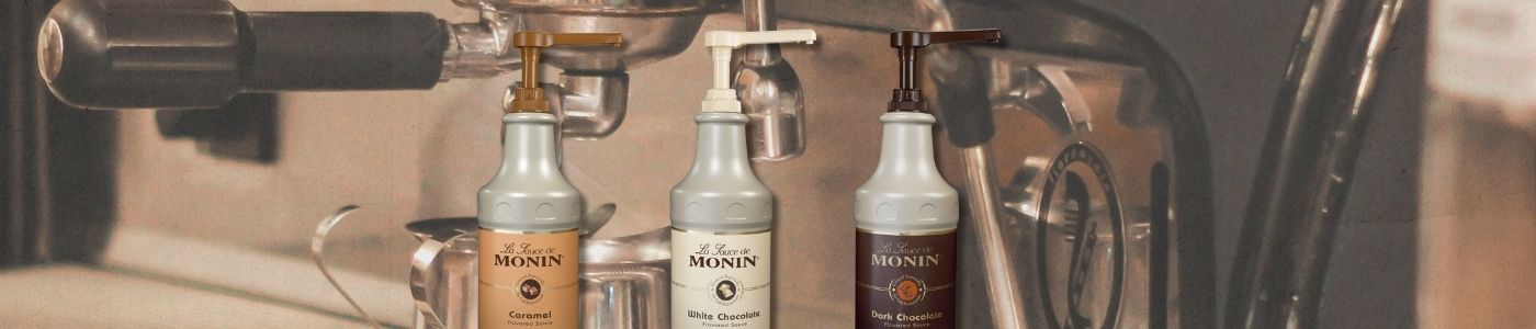 Monin Gourmet Sauces over an espresso machine