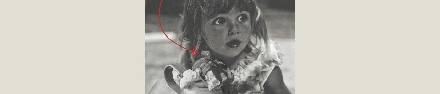 girl eating a hot fudge sundae