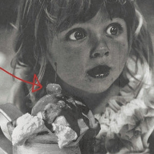 girl eating a hot fudge sundae