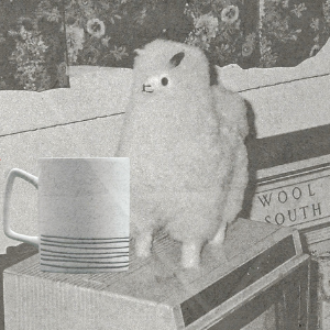 alpaca and coffee cup on tv