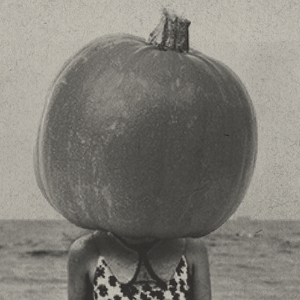 pumpkin on a woman's head