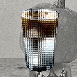 pumpkin vanilla coffee soda over a pumpkin head